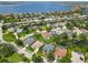 Scenic aerial view of waterfront homes with boat docks, situated along canals leading to a large bay at 315 36Th Ne St, Bradenton, FL 34208
