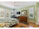 Bright bedroom with wood floors, neutral walls, and a comfortable sitting area by the windows at 315 36Th Ne St, Bradenton, FL 34208