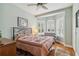 Inviting bedroom with hardwood floors and natural light from a large window at 315 36Th Ne St, Bradenton, FL 34208