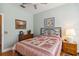 Cozy bedroom features a comfortable bed, matching nightstands, and light mint-colored walls at 315 36Th Ne St, Bradenton, FL 34208