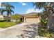Exterior view of a single Gathering home showcasing its driveway and well-maintained landscaping on a bright day at 315 36Th Ne St, Bradenton, FL 34208