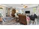 Spacious living room with hard surface flooring, ceiling fan, and comfortable furniture in a well-lit home at 315 36Th Ne St, Bradenton, FL 34208