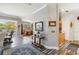 Open-concept living area with hard surface floors leading to dining and kitchen areas in a well-lit home at 315 36Th Ne St, Bradenton, FL 34208