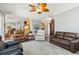 Bright and airy open-concept living area showcasing wood look flooring and comfortable seating arrangements at 315 36Th Ne St, Bradenton, FL 34208