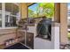 Covered outdoor kitchen with built-in grill, storage cabinets, and counter space at 315 36Th Ne St, Bradenton, FL 34208