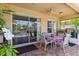 Spacious brick patio with outdoor kitchen, dining area, and views of the screened pool at 315 36Th Ne St, Bradenton, FL 34208