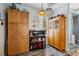 Bright pantry area with wood cabinets, serving cart and stylish light fixture at 315 36Th Ne St, Bradenton, FL 34208