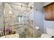 Updated bathroom featuring a marble-tiled shower with glass door and modern fixtures at 315 36Th Ne St, Bradenton, FL 34208