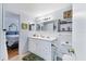 Bathroom featuring a double sink vanity, neutral finishes, and ample counter space at 3240 6Th St, Sarasota, FL 34237