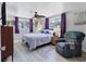 Bright bedroom with a fan, large windows, and neutral color palette at 3240 6Th St, Sarasota, FL 34237