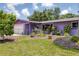 This home offers a manicured front yard with mature landscaping and great curb appeal at 3240 6Th St, Sarasota, FL 34237