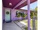 Charming front porch featuring a stylish door and beautiful landscaping, enhancing curb appeal at 3240 6Th St, Sarasota, FL 34237