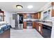 Kitchen featuring stainless steel appliances, granite counters and ample cabinet space at 3240 6Th St, Sarasota, FL 34237