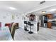 Open dining and kitchen area, with granite counters and stainless steel appliances at 3240 6Th St, Sarasota, FL 34237
