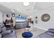 Cozy living room with ceiling fan, light grey flooring, and decor throughout at 3240 6Th St, Sarasota, FL 34237