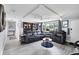 Cozy living room featuring updated flooring, a ceiling fan and comfortable seating at 3240 6Th St, Sarasota, FL 34237