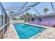 Outdoor pool featuring a screened enclosure, providing a private and refreshing oasis at 3240 6Th St, Sarasota, FL 34237