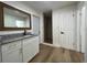 Bathroom featuring wood-look floors, granite countertop and a walk-in shower at 3429 37Th N St, St Petersburg, FL 33713
