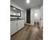 Bathroom featuring wood-look floors, granite countertop and a walk-in shower at 3429 37Th N St, St Petersburg, FL 33713