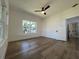 Bedroom with wood-look floors, a ceiling fan, and natural light from the windows at 3429 37Th N St, St Petersburg, FL 33713