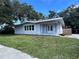 Charming, newly renovated one story home with light-blue painted siding and a large, well-maintained front yard at 3429 37Th N St, St Petersburg, FL 33713