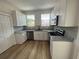 Modern kitchen with stainless steel appliances, light countertops, and newly installed cabinetry at 3429 37Th N St, St Petersburg, FL 33713