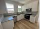 Well-lit kitchen featuring light granite countertops, stainless steel appliances, and white subway tile backsplash at 3429 37Th N St, St Petersburg, FL 33713