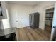 Modern kitchen featuring stainless steel refrigerator, new appliances, countertops and door leading to bathroom at 3429 37Th N St, St Petersburg, FL 33713