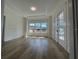 Bright living room with wood-look floors, white trim, and lots of natural light at 3429 37Th N St, St Petersburg, FL 33713