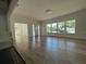 Bright and spacious living room with hardwood floors, many windows, an open door, and recessed lighting at 3429 37Th N St, St Petersburg, FL 33713