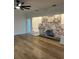 Cozy living room with decorative painted brick fireplace and modern floors, bathed in natural light at 3429 37Th N St, St Petersburg, FL 33713