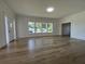 Large living room with hardwood floors, modern finishes, bright sunlight and open entrance ways at 3429 37Th N St, St Petersburg, FL 33713
