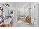 Spacious primary bathroom with a large soaking tub, separate shower, and double sinks at 3671 Summerwind Cir, Bradenton, FL 34209