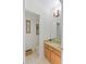 Cozy half bath with granite countertop and wood cabinets at 3671 Summerwind Cir, Bradenton, FL 34209