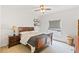 Bedroom with a dark wood bed frame and a window with blinds at 3671 Summerwind Cir, Bradenton, FL 34209