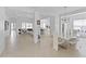 This dining room features tile flooring and an open transition to the kitchen and living room at 3671 Summerwind Cir, Bradenton, FL 34209