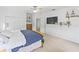 Spacious primary bedroom featuring a bed, storage, and a ceiling fan at 3671 Summerwind Cir, Bradenton, FL 34209