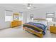 Spacious primary bedroom with natural light, and a large bed at 3671 Summerwind Cir, Bradenton, FL 34209