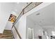 Staircase with modern railing, an art piece, and great natural light at 3671 Summerwind Cir, Bradenton, FL 34209