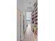 A spacious walk-in closet with custom shelving, shoe racks, and ample storage for your wardrobe at 3671 Summerwind Cir, Bradenton, FL 34209