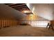 Spacious unfinished attic space ready for your renovation ideas with plywood flooring and some exposed rafters at 3804 65Th E St, Bradenton, FL 34208