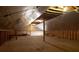 Spacious unfinished attic space ready for your renovation ideas with plywood flooring and some exposed rafters at 3804 65Th E St, Bradenton, FL 34208
