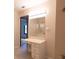 Bathroom featuring a vanity with drawers, a mirror and a view into another room at 3804 65Th E St, Bradenton, FL 34208