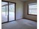 Bright bedroom with sliding glass doors to pool area, blending indoor-outdoor living seamlessly at 3804 65Th E St, Bradenton, FL 34208