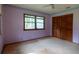 Bedroom featuring carpet, large windows and spacious closet, offering both comfort and convenience at 3804 65Th E St, Bradenton, FL 34208