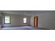 Spacious bedroom with multiple windows and carpet, providing natural light at 3804 65Th E St, Bradenton, FL 34208