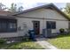 Exterior view of the home showcasing the siding, roof, and air conditioning unit at 3804 65Th E St, Bradenton, FL 34208