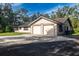 Attractive home featuring an attached two-car garage and a well-maintained lawn at 3804 65Th E St, Bradenton, FL 34208
