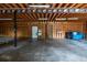 Attached garage featuring wood construction, concrete floors and Coors Light decorations at 3804 65Th E St, Bradenton, FL 34208