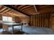 Attached garage featuring wood construction, concrete floors, and various work tables at 3804 65Th E St, Bradenton, FL 34208